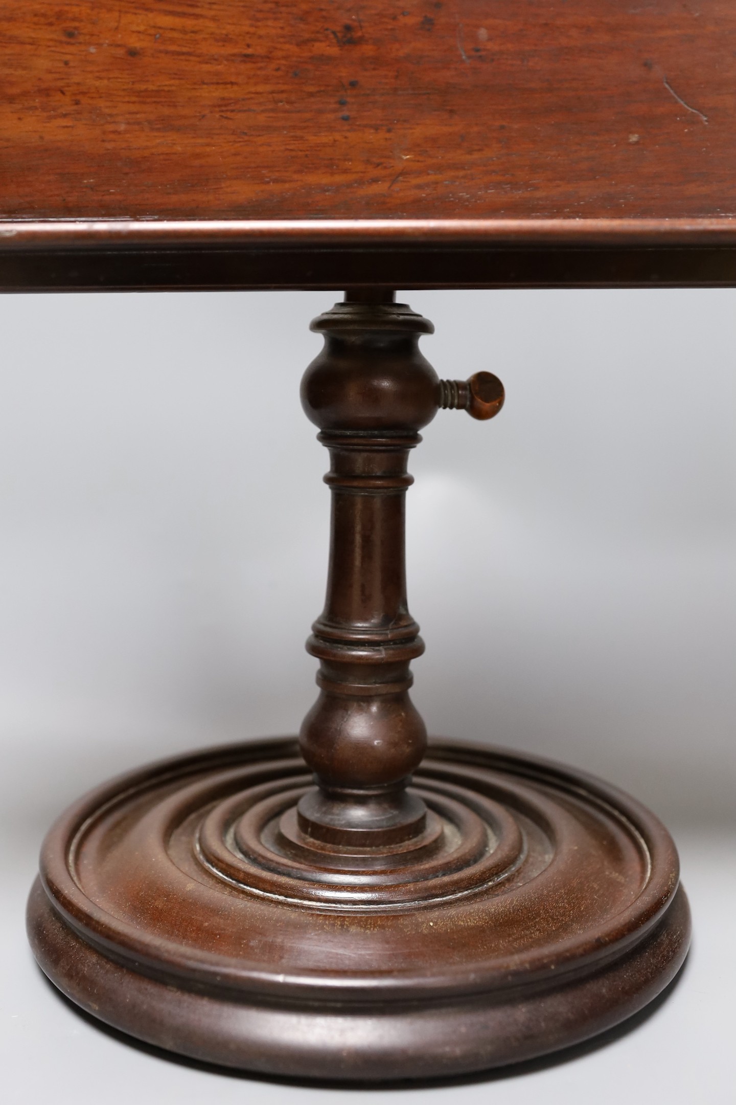 A 19th century turned mahogany book/ music stand, 49 cms high